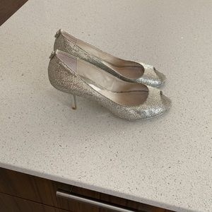 Michael kors size 9 ., silver Worn a few times . Slightly used in the front.